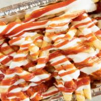 Loaded French Fries · Loaded fries with salt, pepper, ketchup, white sauce and hot sauce.
