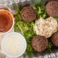 Falafel (4Pcs) · Mixed vegetables and special spices combined to create a delicious deep fried veggie ball ma...