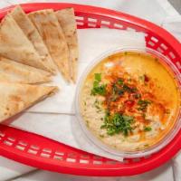 Hummus · A blend of chickpea puree and tahini sauce flavored with lemon, and olive oil.