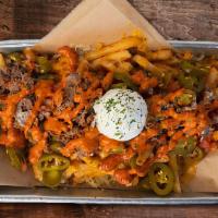 Loaded Fries · French fries with chile con queso, tomatoes, jalapeños, chipotle mayo and sour cream. All of...