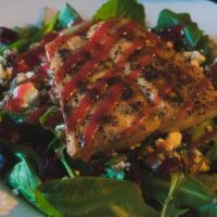 Greek Salad · Spring mix, cranberries, walnuts, and Feta cheese, topped with chicken breast, served with o...