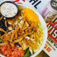The Tejano · Greens, grilled chicken with onion strings, black beans, corn, tomato, cheese, and chipotle ...