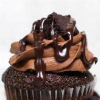 Brownie Molten Cupcake · Chocolate cupcake with ganache filling, chocolate buttercream and topped with a brownie