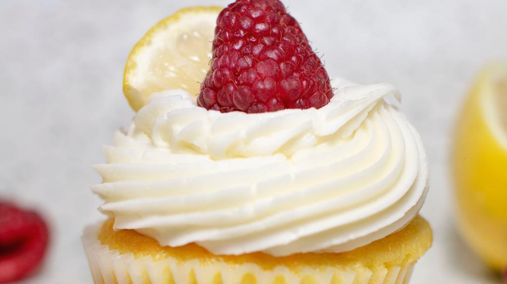 Lemon Raspberry · Lemon cake, raspberry filling, cream cheese frosting with a fresh raspberry and lemon.