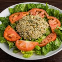 Quinoa Salad · Bed of romaine lettuce with a mixture of quinoa, green and brown lentils, parsley and tomato...