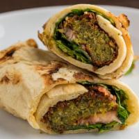 Falafel Pita · Grilled Chickpea falafel fried falafel patties, lettuce, tomato and garlic sauce wrapped a  ...