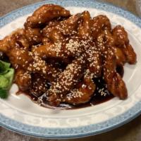 Sesame Chicken · Large chunks of chicken, deep-fried until crispy, then covered with a tangy sauce and sprink...