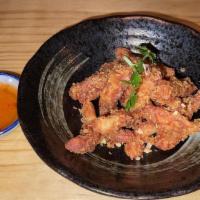 Turmeric Fried Calamari · With sweet chili sauce.