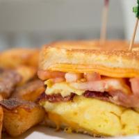 Egg Sandwich- · Fresh Eggs, Bacon, Cheddar Cheese And Tomatoes On Grilled White Bread Served With Breakfast ...