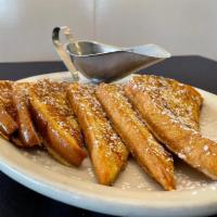 French Toast- · Texas Toast Soaked In Our Delicious Brandy, Cream Batter. Topped With Powdered Sugar