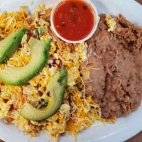 Migas · Eggs scrambled with onions, tomatoes, tortilla strips, and jalapenos.