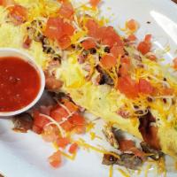 Meat Lovers Omlette · Cooked with bell peppers, onions, mixed cheese, bacon, sausage, ham and tomatoes