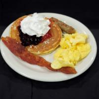 Pancake Combo · 1 buttermilk pancake, one scrambled egg, 1 bacon and 1 sausage. 
*Topped with strawberries