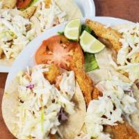 Fish Tacos · Served on corn tortillas with coleslaw and pico de gallo.