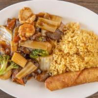 Triple Delight · Beef, chicken, and shrimp stir fried with an assortment of vegetables in a brown sauce.
