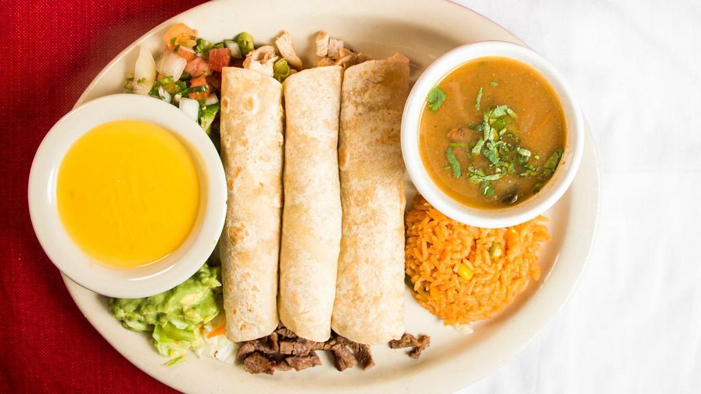 Tacos Al Carbon · Beef or pork carnitas or chicken fajita tacos served with pico de gallo, guacamole, rice and charro beans. Covered with cheese.