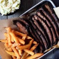 Texas Brisket Plate - Sliced · Smoked 12-13 hours and sliced to order, served with two Southern Sides.. Add a Garden or Cae...