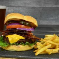 Hickory Bacon Burger · Bacon, cheddar cheese, sautéed onions,. and our Mojo Mild sauce.. Served with Crispy Fries.