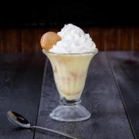 Banana Pudding · Rich vanilla pudding with bananas slices and vanilla wafers, topped with whipped cream and a...