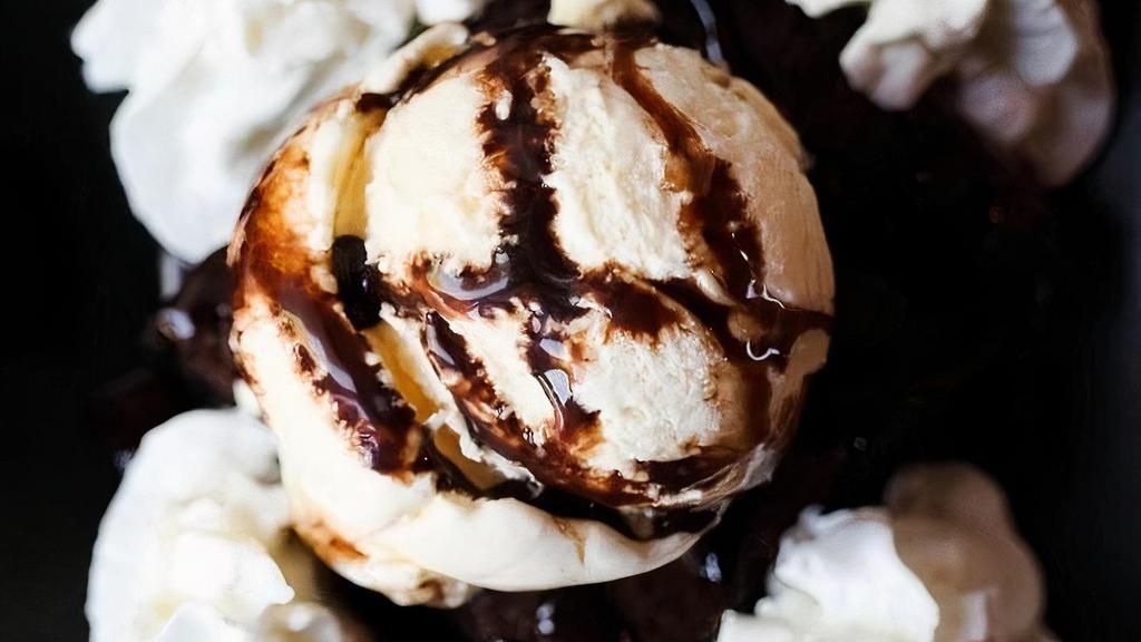 Brownie Sundae · Fresh-baked chocolate brownie, vanilla ice cream, chocolate sauce, whipped cream and a cherry.