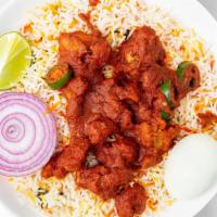 Bezawada Chicken Biryani · Basmati rice cooked with tender chunks of chicken, blended with herbs and spices then garnis...