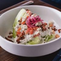 Silvia'S Wedge · Gluten free. A fresh iceberg wedge with our house Gorgonzola dressing, bacon, tomato and pic...