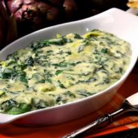 Spinach & Artichoke Dip · Spinach & artichokes blended with five cheeses & served with a seasoned garlic flatbread bak...