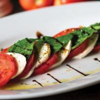 Insalata Caprese · Sliced roma tomatoes, fresh basil, fresh mozzarella, drizzled with extra virgin olive oil an...
