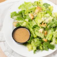 Caesar Salad · Romaine lettuce, garlic croutons & parmesan cheese tossed with our Caesar dressing.
