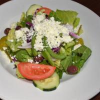 Greek Salad · Fresh romaine lettuce sprinkled with feta cheese, kalamata olives, garden vegetables, and Ru...