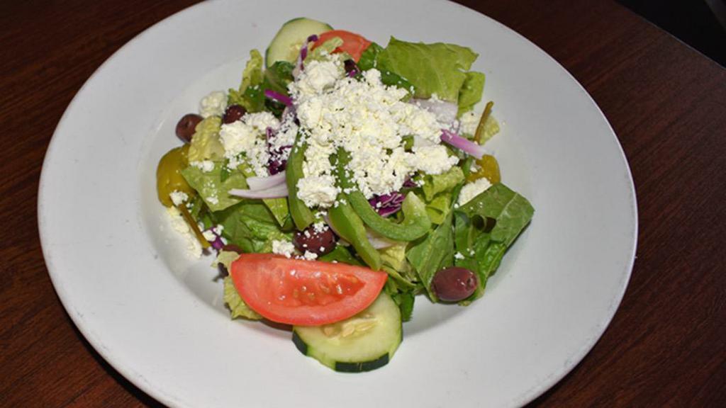 Greek Salad · Fresh romaine lettuce sprinkled with feta cheese, kalamata olives, garden vegetables, and Russo’s balsamic vinaigrette dressing. Side 240 cal., entrée 340 cal.
