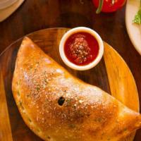 Create-Your-Own Calzone · Up to three toppings of your choice. We’ll add the mozzarella.