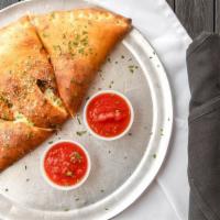 Stromboli · Russo’s family favorite. Pepperoni, Italian sausage, mushrooms, black olives, bell peppers, ...
