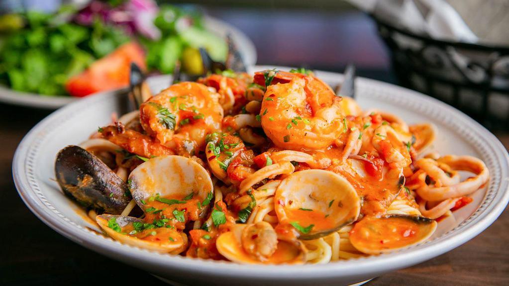 Pasta Di Mare · Sautéed shrimp, clams, mussels and calamari, swirled in a spicy Pinot Grigio marinara sauce, served over freshly-made spaghetti.