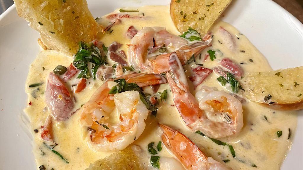 Shrimp Al Pepperoncini · Shrimp sautéed with prosciutto, white wine cream sauce, capers, red bell peppers and herbs. Served with garlic bread.