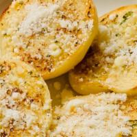 Garlic Bread  · Homemade bread toasted with garlic butter and parmesan cheese