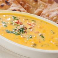 Chile Con Queso · Cheese dip, served with flour tortilla chips.