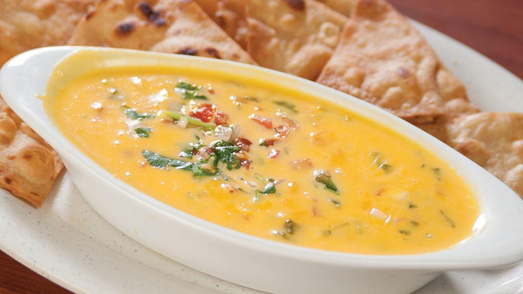 Chile Con Queso (Original) · Cheese dip, served with flour tortilla chips.