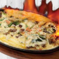 Queso Flameado · Melted oaxaca cheese with your choice of meat. With grilled onions and poblano peppers.