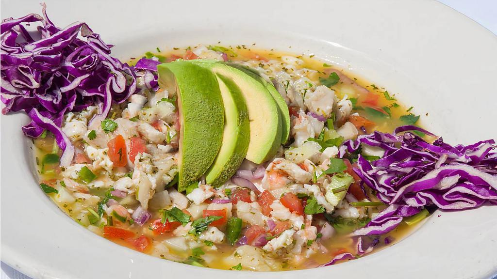 Ceviche Clasico · Fresh raw fish, shrimp, or mixed. Marinated in lime juice and mixed with diced onions, cucumbers, tomato, cilantro, jalapeño, and citrus juices.