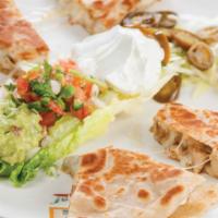 Quesadillas · Hand-made flour tortillas filled with choice of meat and Monterey Jack cheese, served with s...