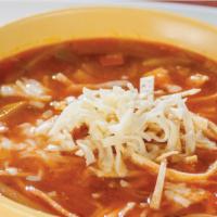 Tortilla Soup · Vegetable soup with tortilla chips and cheese, served with rice, pico de gallo, and flour to...
