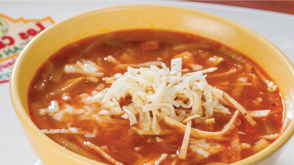 Tortilla Soup · Vegetable soup with tortilla chips and cheese, served with rice, pico de gallo, and flour tortillas. Add chicken for an additional charge.