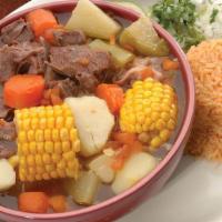 Caldo De Res · Delicious beef soup with carrots, corn, and potatoes. Served with rice, onions, and cilantro.