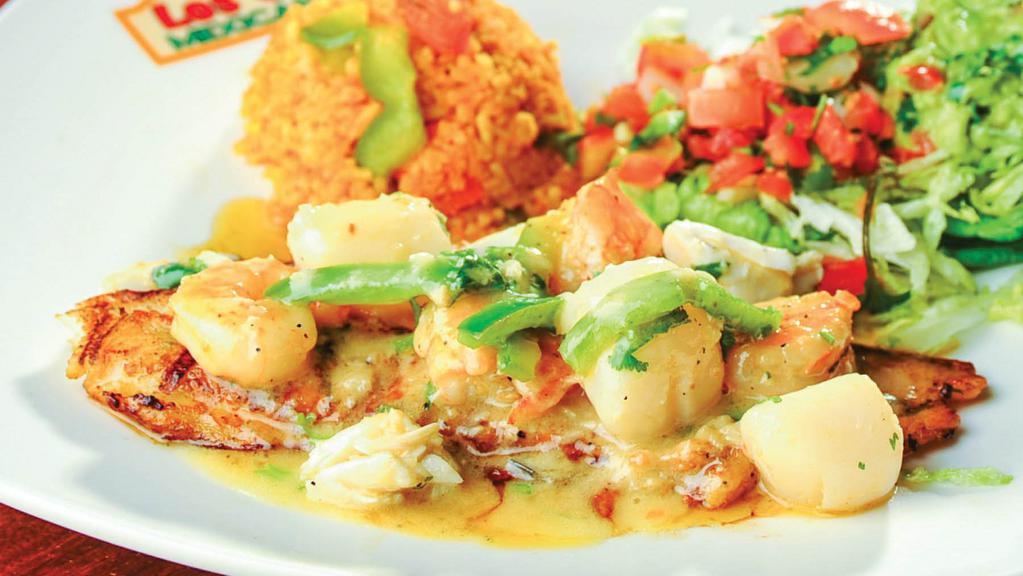 Fish Cancún · 10 oz. fresh bass fillet, sautéed in butter sauce, garlic, and cilantro. Topped with crab meat, shrimp, scallops, and sliced bell peppers. Substitute fish for tilapia or salmon for an additional charge.