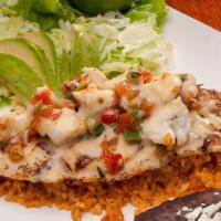 Fish Playa Azul · Grilled bass fish fillet, served on a bed of rice and topped with crab meat, lemon butter sa...