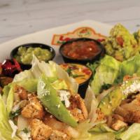 Lettuce Wrap Tacos · Lettuce wrap tacos, topped with onions, avocado, and queso fresco. Served with grilled veget...