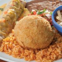 Chicken Stuffed Avocado · (1) deep-fried avocado stuffed with chicken and cheese and (1) beef fajita taco, covered wit...