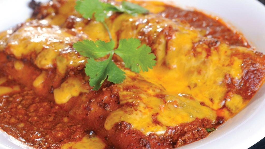 Cheese Enchiladas · (2) cheese enchiladas covered with beef gravy and cheddar cheese. Served with rice and beans.