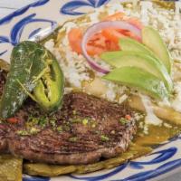 Enchiladas Michoacan · 8 oz. New York steak with 3 tomatillo enchiladas, topped with sour cream, queso fresco, and ...